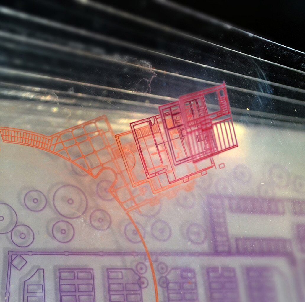 Detailed photograph of the overlapping transparent plans for Unstant